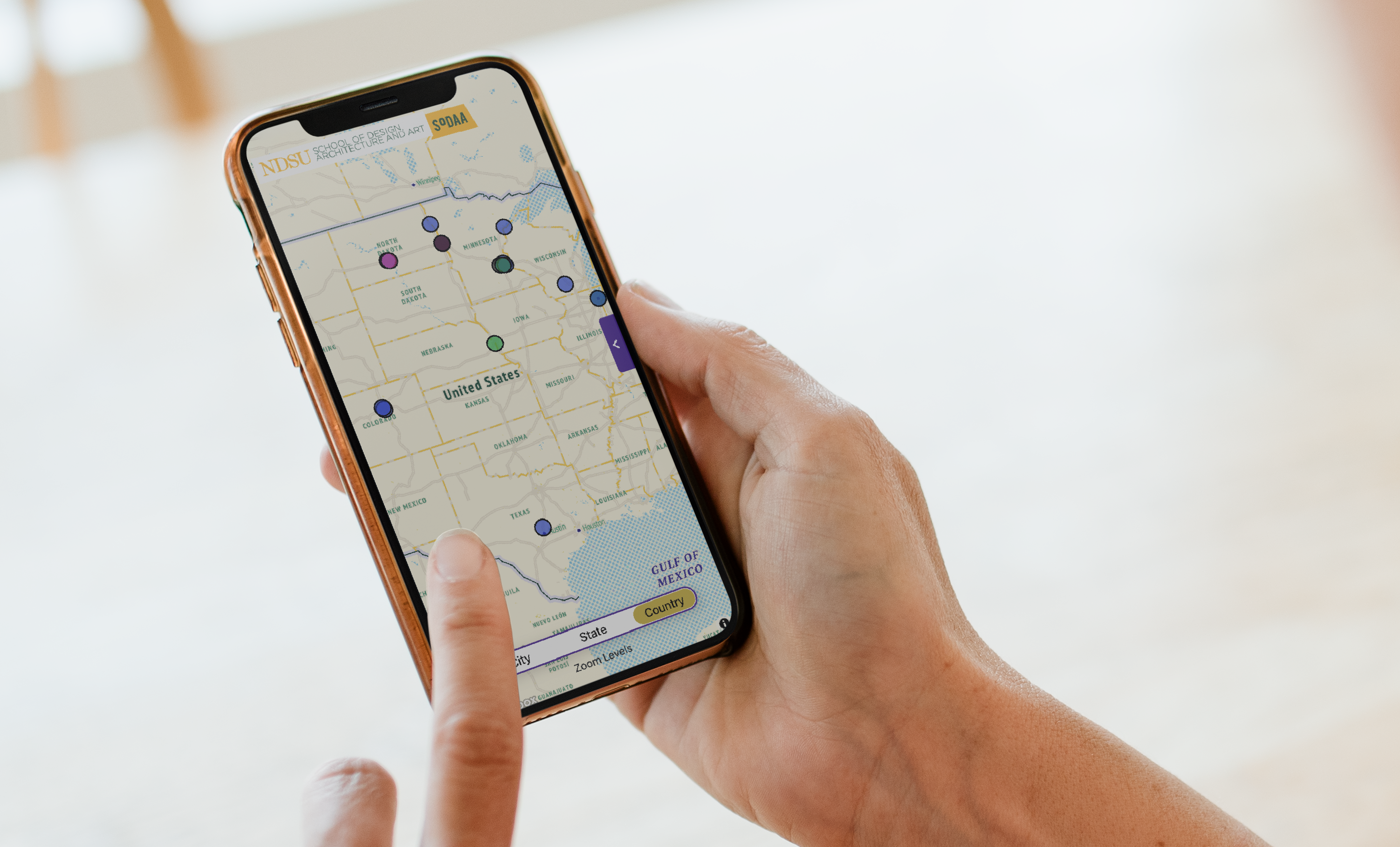 SODAA Alumni Map handheld phone mockup